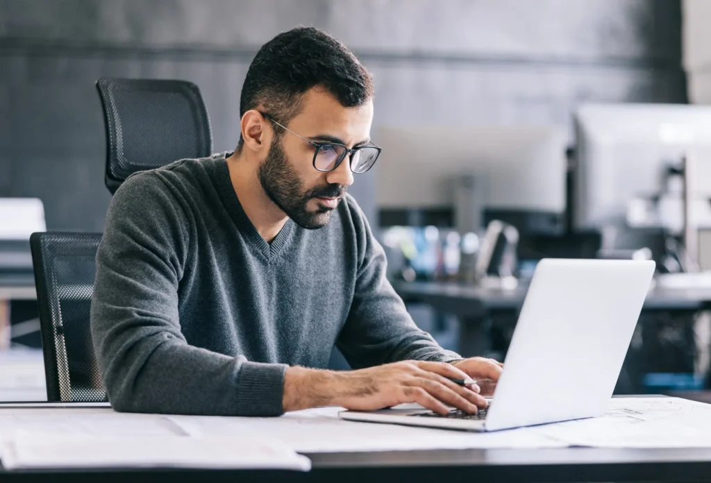 Man reading about recent cyberattacks highlight growing data risks