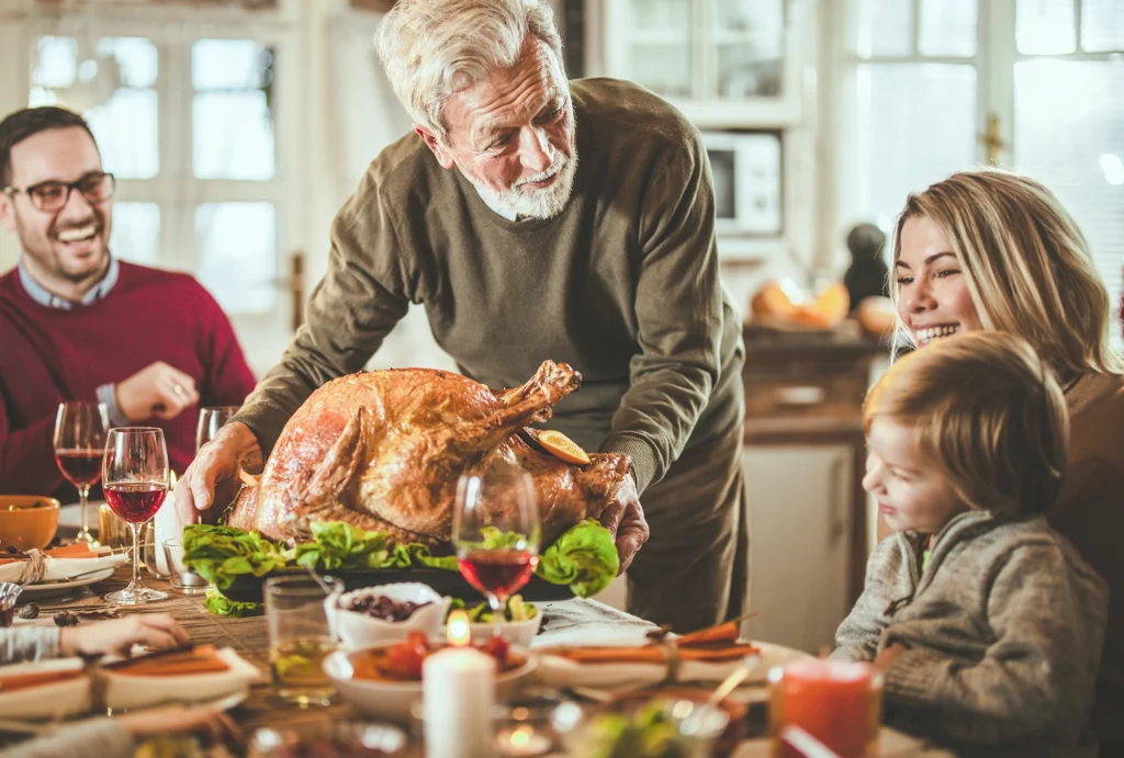 Family discussing the value of giving and gratitude and Thanksgiving