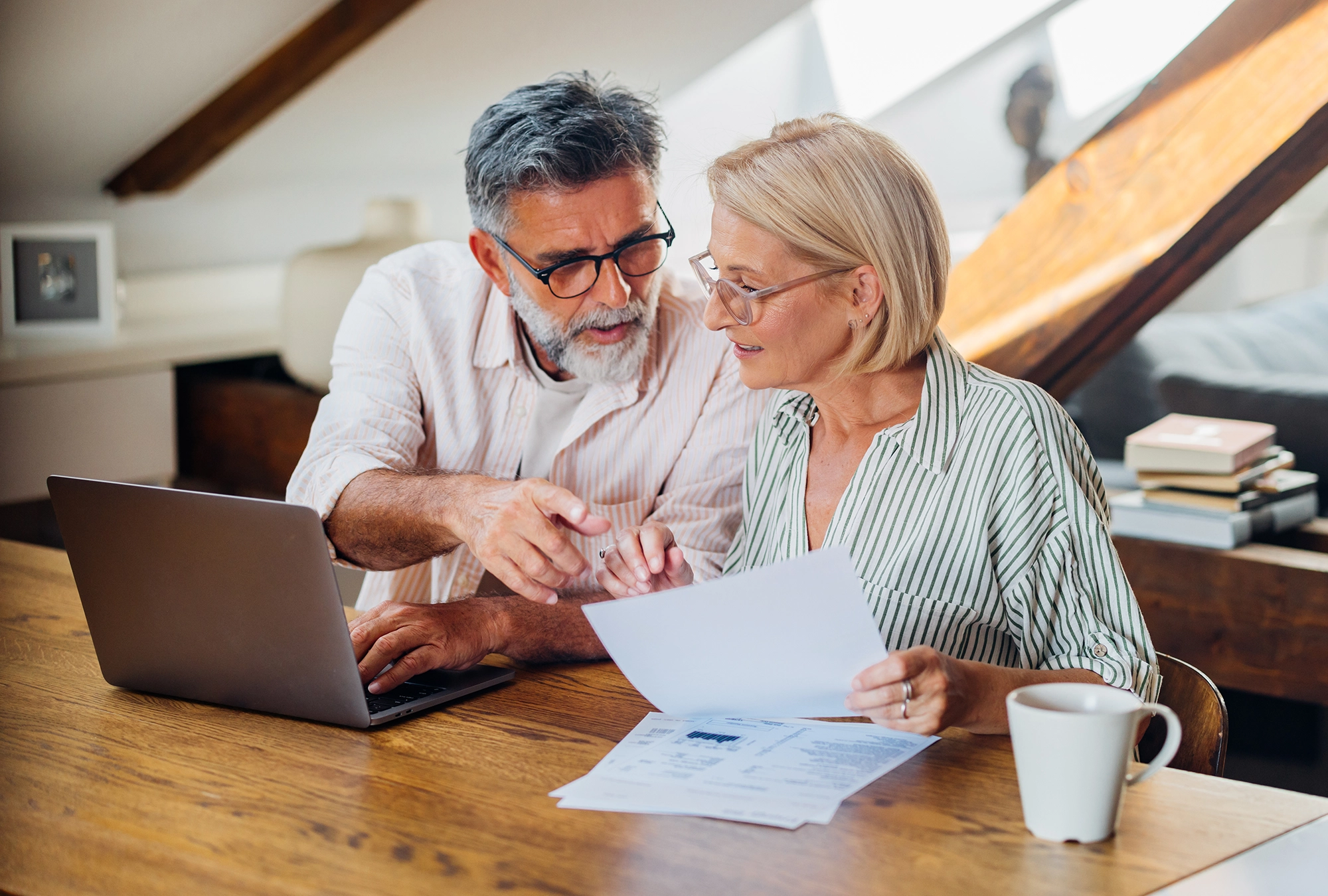 Couple reading about Catch-up contributions 401(k)