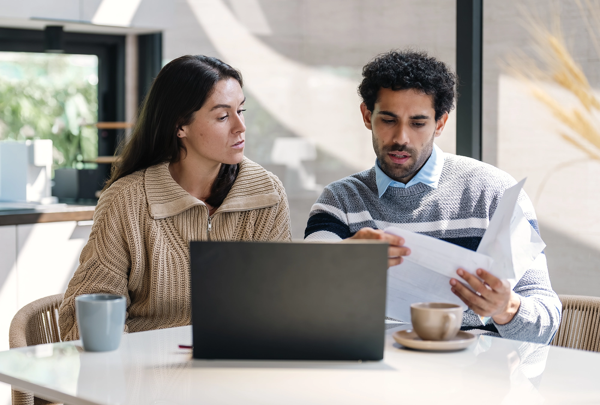 Couple discussing traditional and Roth IRA