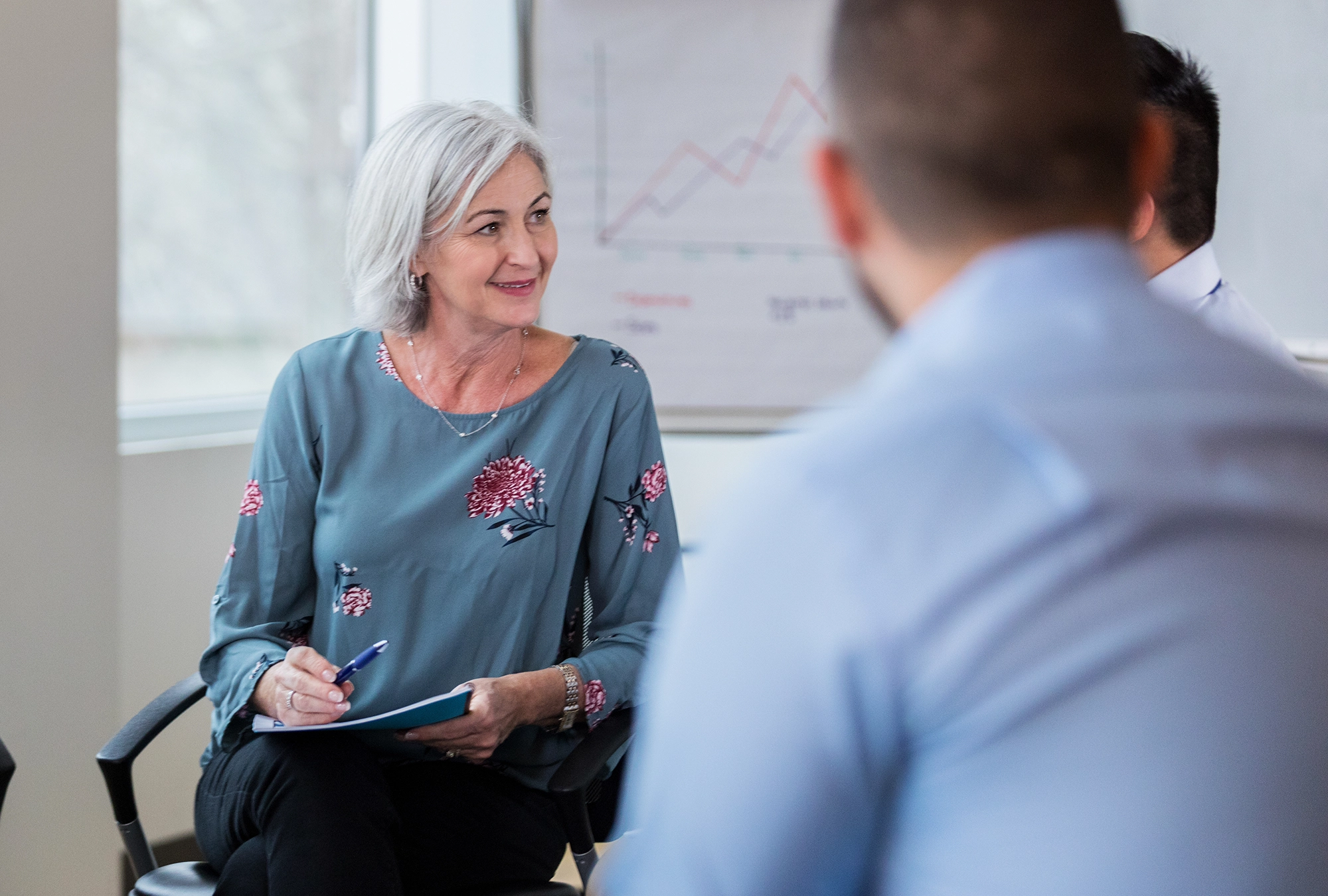 woman donor talking to nonprofit executives