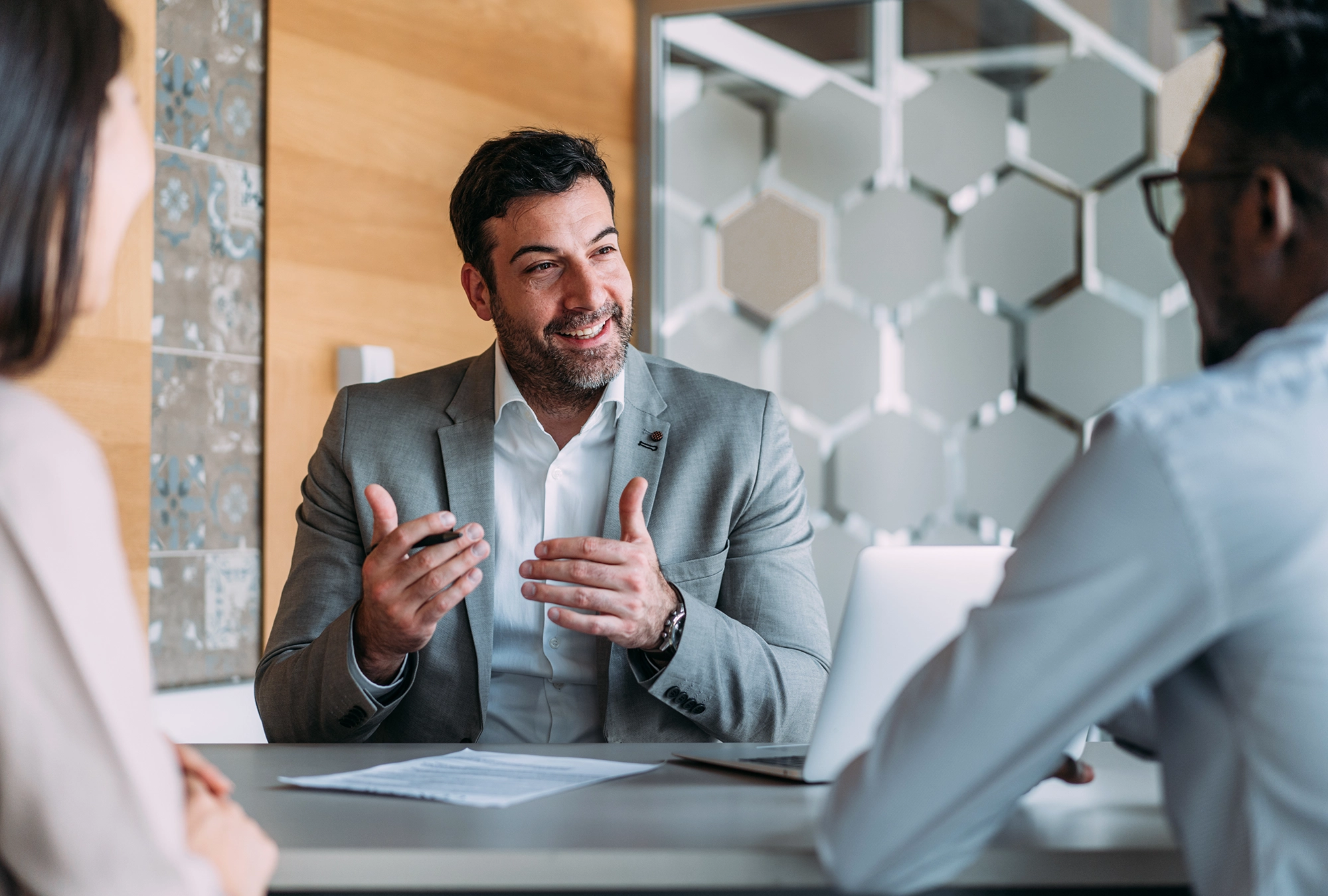 people meeting with a financial advisor in a conference room